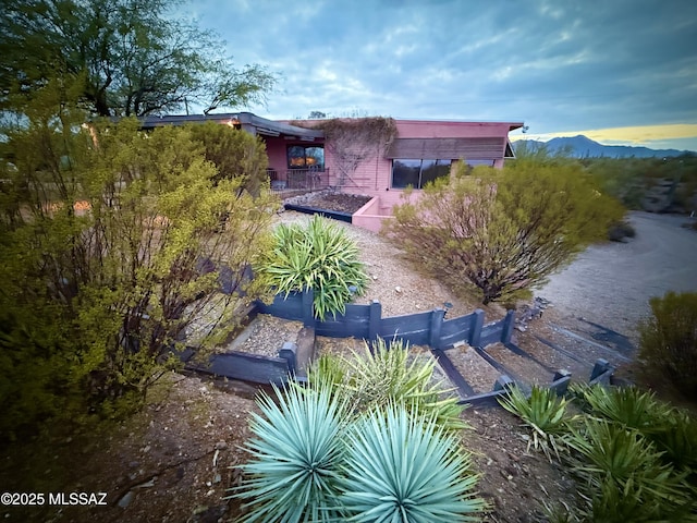 birds eye view of property with a mountain view