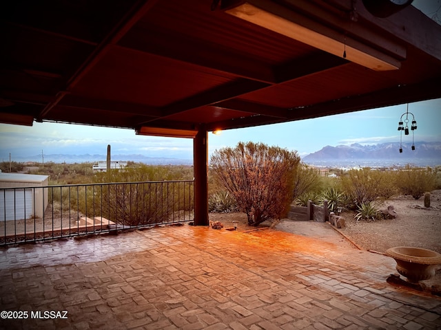 view of patio / terrace featuring a mountain view