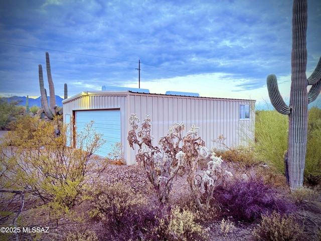 view of outbuilding with a garage