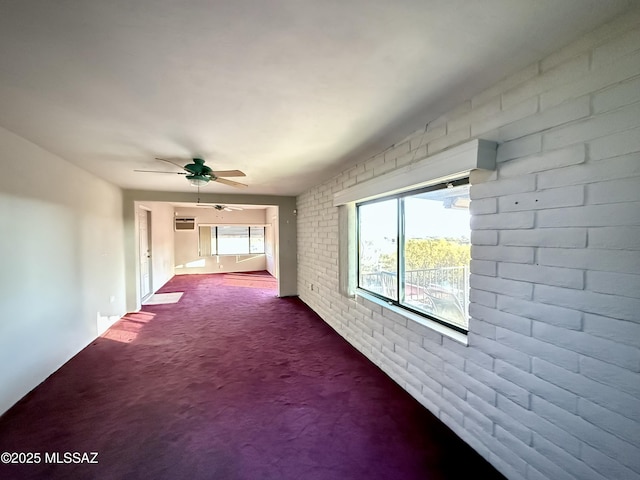 hall featuring carpet and brick wall