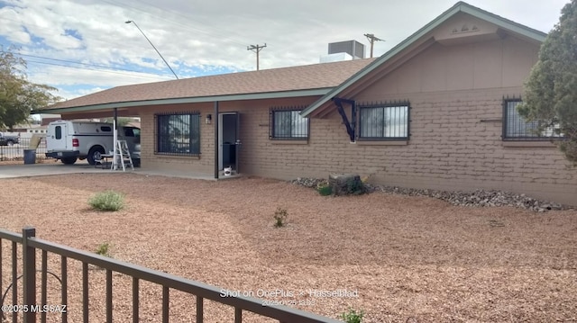 ranch-style home with a carport