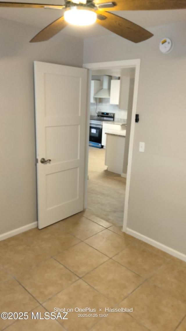 hallway with light tile patterned floors