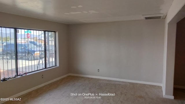 spare room with light tile patterned floors