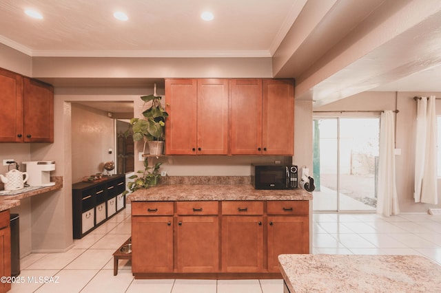 kitchen featuring ornamental molding, light stone countertops, and light tile patterned floors