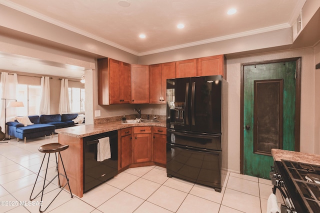 kitchen featuring black appliances, sink, a kitchen bar, ornamental molding, and kitchen peninsula