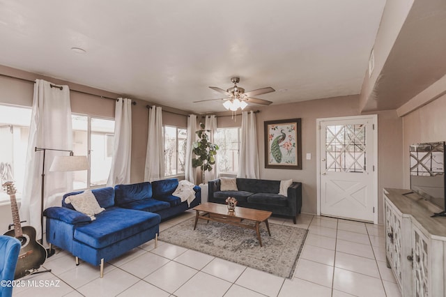 tiled living room featuring ceiling fan