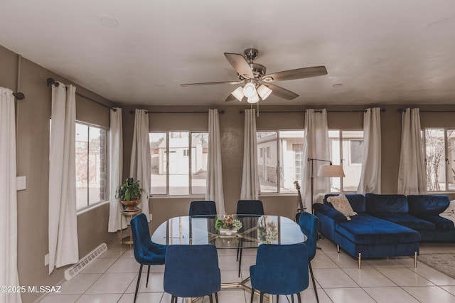 dining room with light tile patterned floors and ceiling fan