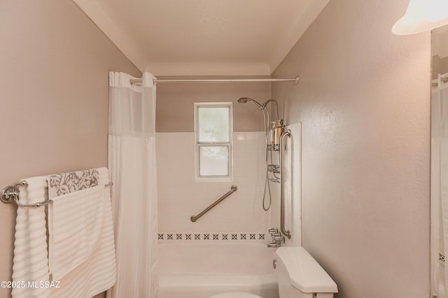 bathroom featuring toilet and shower / tub combo