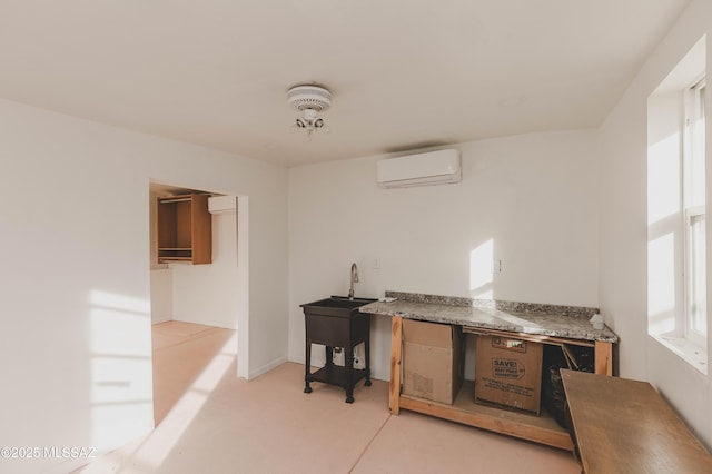 kitchen featuring an AC wall unit