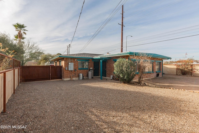 rear view of property featuring a patio