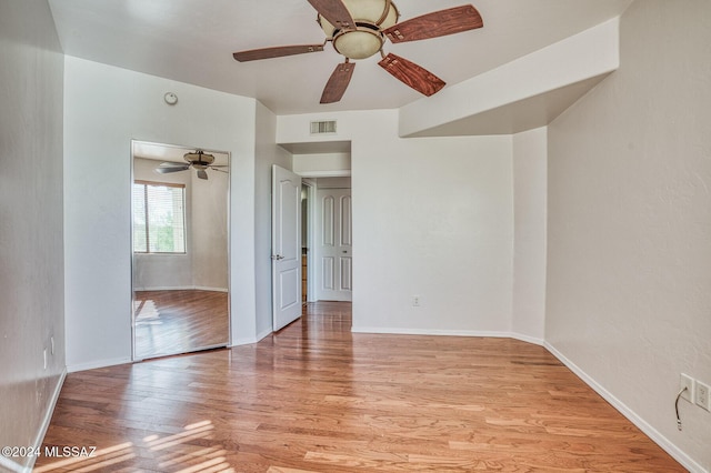 unfurnished room featuring ceiling fan and light hardwood / wood-style flooring