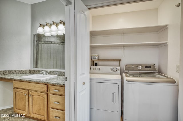 laundry area with sink and independent washer and dryer