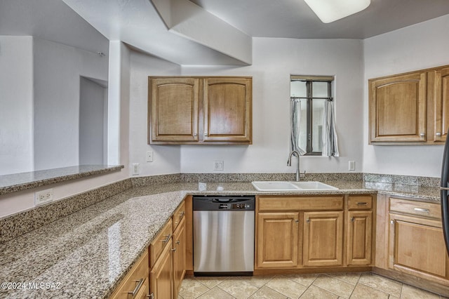 kitchen with sink, light tile patterned floors, stainless steel dishwasher, and light stone countertops