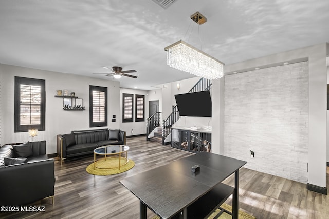 living room featuring hardwood / wood-style flooring and ceiling fan