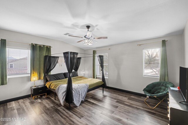 bedroom with light hardwood / wood-style floors, ceiling fan, and a closet