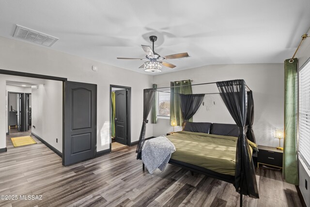 office with hardwood / wood-style floors and ceiling fan