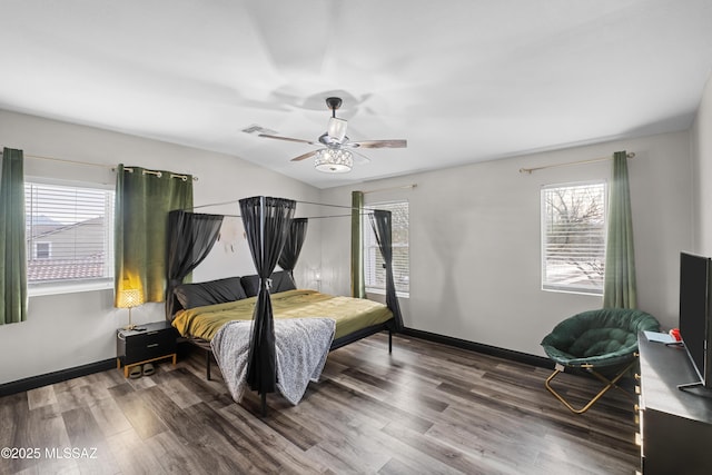 bedroom featuring vaulted ceiling, hardwood / wood-style floors, and ceiling fan