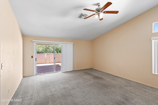 unfurnished room with ceiling fan and carpet flooring