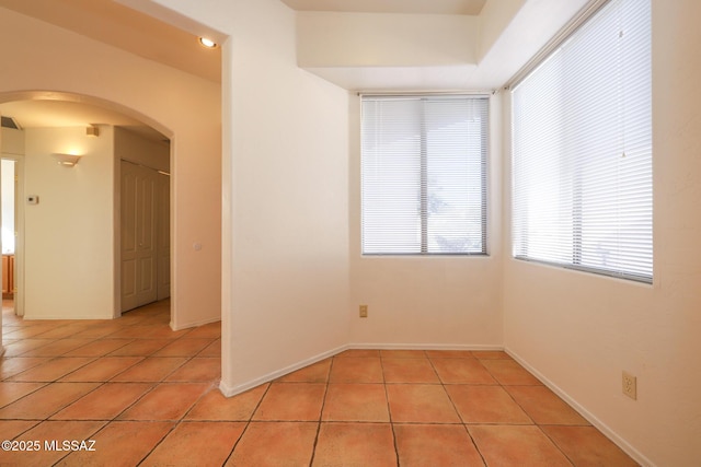 empty room featuring light tile patterned floors