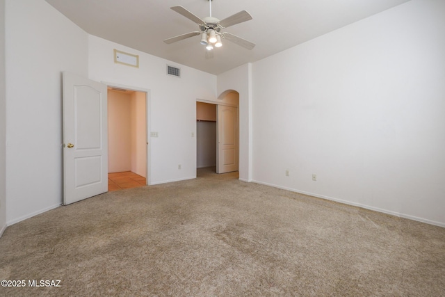 unfurnished bedroom featuring ceiling fan and light carpet