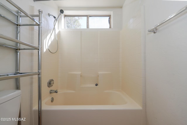 bathroom with toilet and shower / bath combination