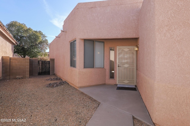 doorway to property featuring a patio area