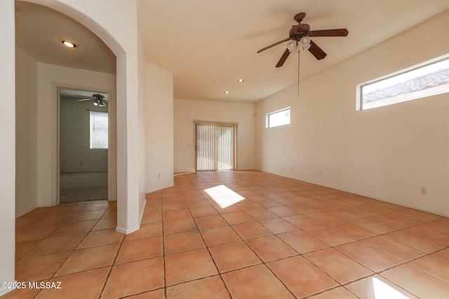 spare room with light tile patterned floors and ceiling fan