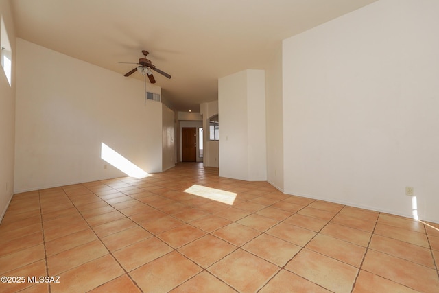 empty room featuring ceiling fan and light tile patterned floors