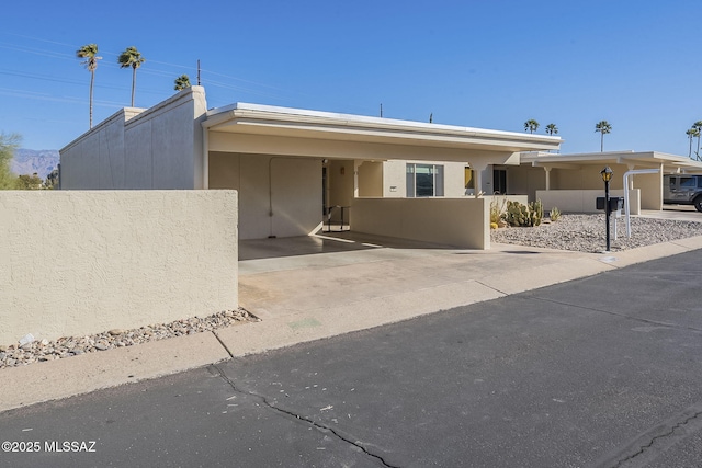 view of front of property with a carport