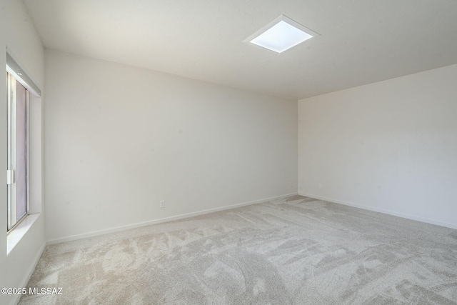 empty room with light colored carpet