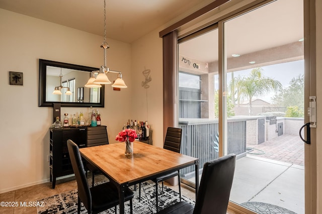 dining area featuring tile patterned floors