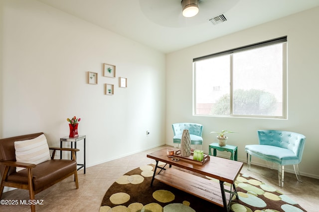 sitting room with light tile patterned flooring and ceiling fan