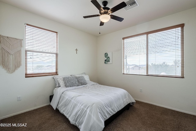 bedroom featuring dark carpet and ceiling fan