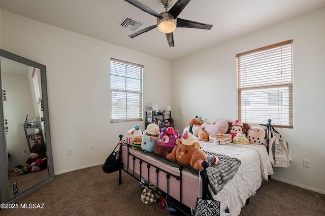 bedroom featuring dark carpet and ceiling fan