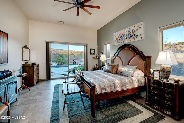 bedroom with high vaulted ceiling, a mountain view, access to outside, and ceiling fan