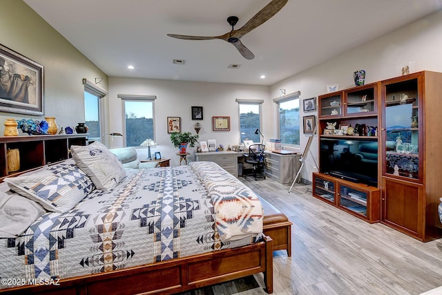 bedroom with ceiling fan and light hardwood / wood-style flooring