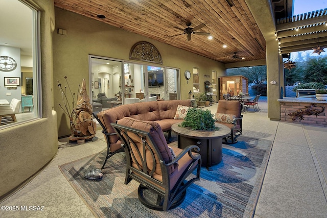 view of patio / terrace with ceiling fan and an outdoor living space