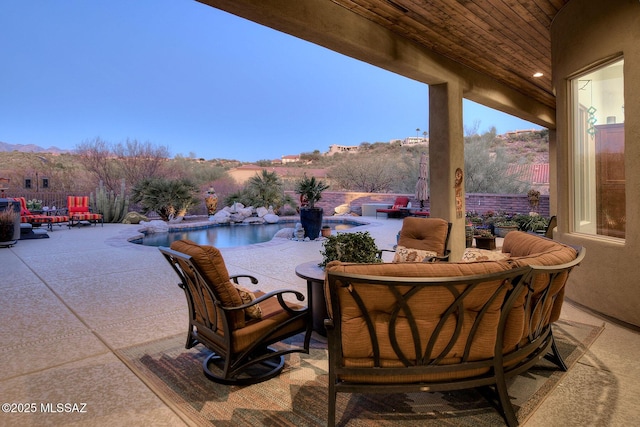 view of patio / terrace featuring a mountain view