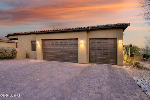 view of front of home featuring a garage and an outdoor structure