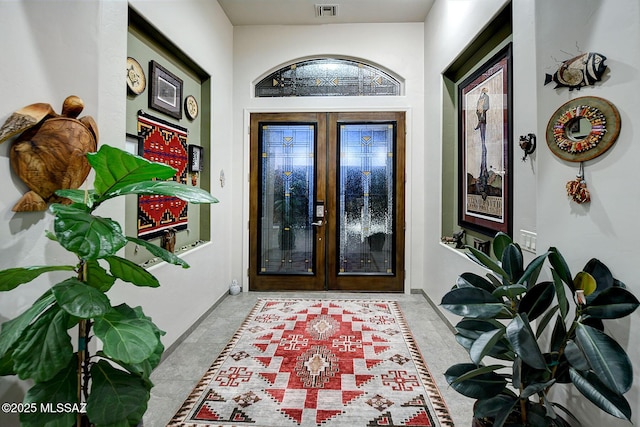 entryway featuring french doors