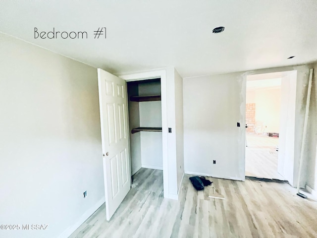 1105 S 1st Ave, Safford, AZ 85546 - unfurnished bedroom with light wood-type flooring