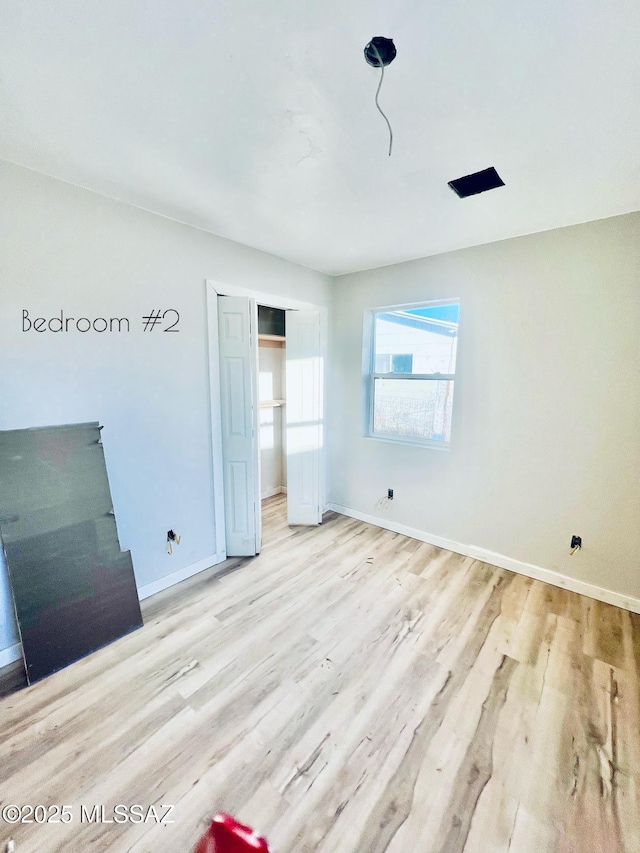 1105 S 1st Ave, Safford, AZ 85546 - unfurnished bedroom featuring light hardwood / wood-style floors