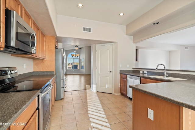 kitchen featuring sink, stainless steel appliances, ceiling fan, and light tile patterned flooring