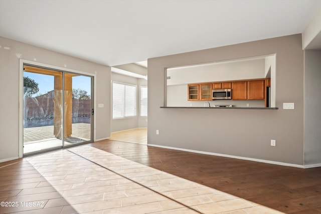 unfurnished living room with light hardwood / wood-style floors