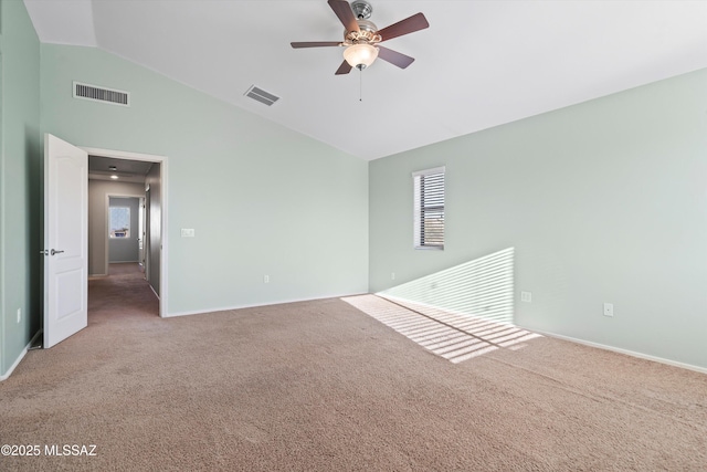 unfurnished room featuring ceiling fan, lofted ceiling, and carpet