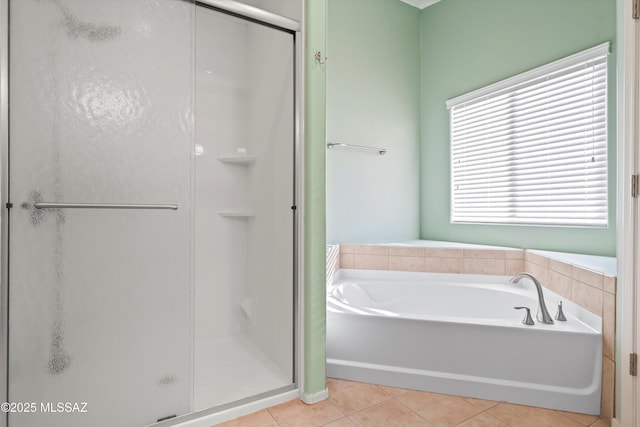 bathroom with tile patterned flooring and plus walk in shower