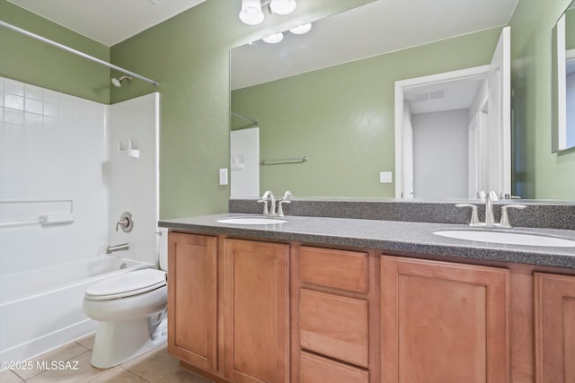 full bathroom featuring tile patterned flooring, vanity, toilet, and washtub / shower combination