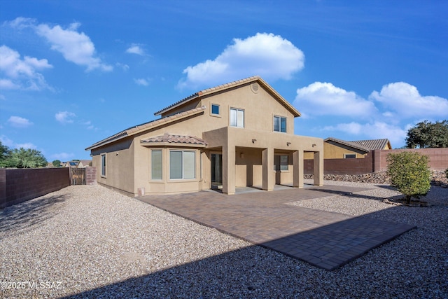 back of property with a patio area