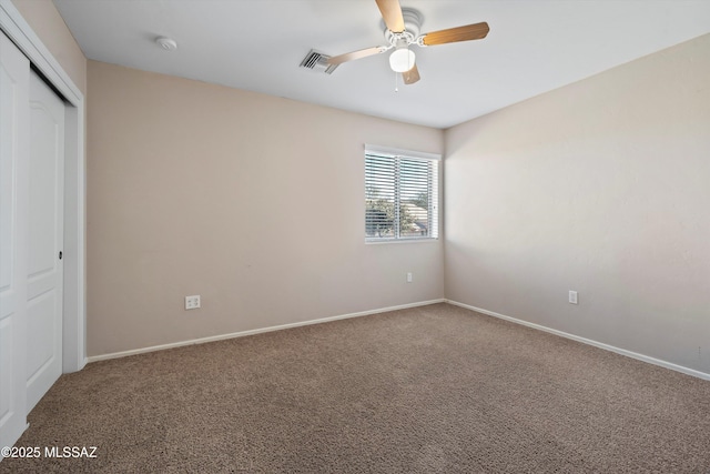 unfurnished bedroom with ceiling fan, a closet, and carpet