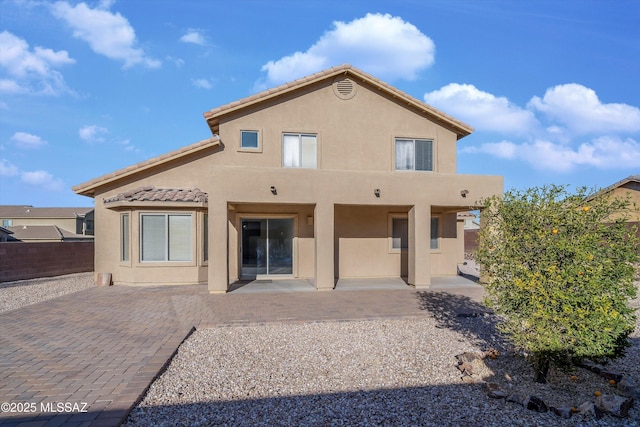 rear view of house with a patio